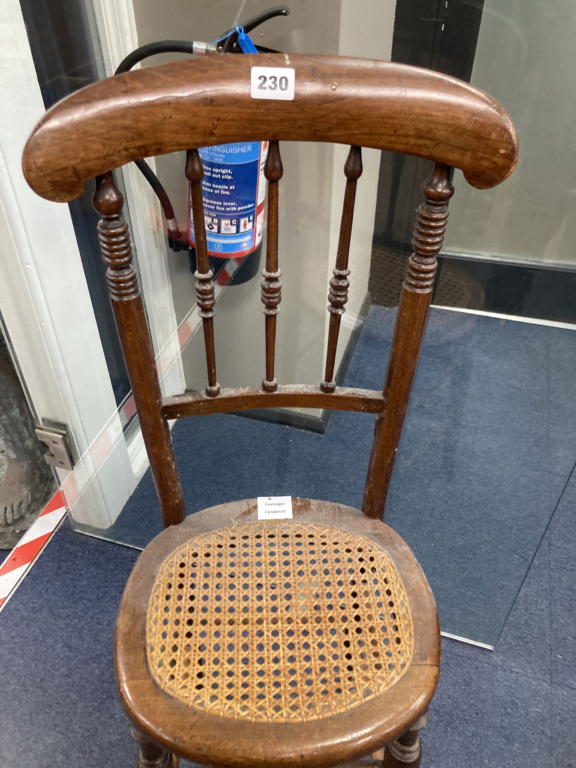 A Victorian beech cane seat correction chair